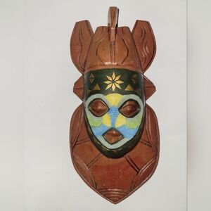 Handcrafted Tribal Mask with Colorful Accents